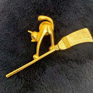 Vintage 80’s Avon Brooch of a Bewitching Cat on a Broomstick, Stamped
